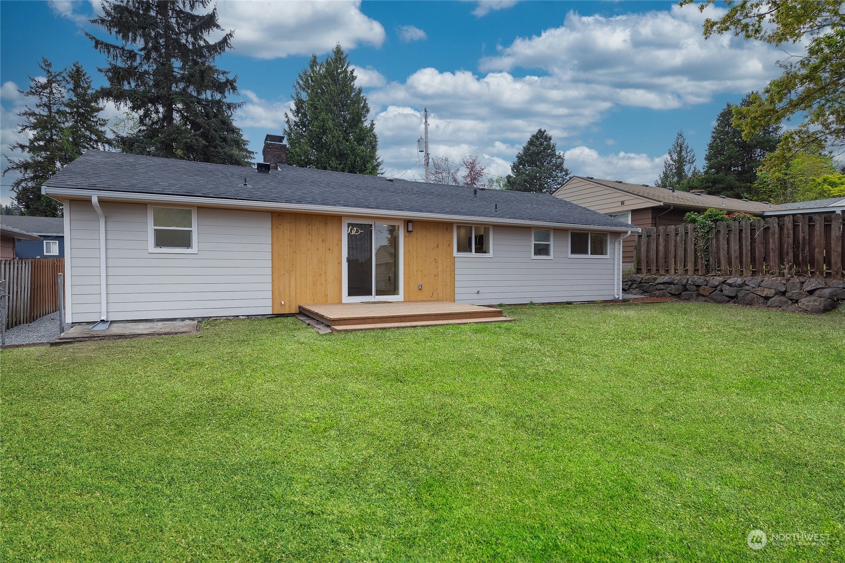 7614 South 113th Street Seattle, WA 98178 - Photo 3 of 24 a view of a house with a yard and fence