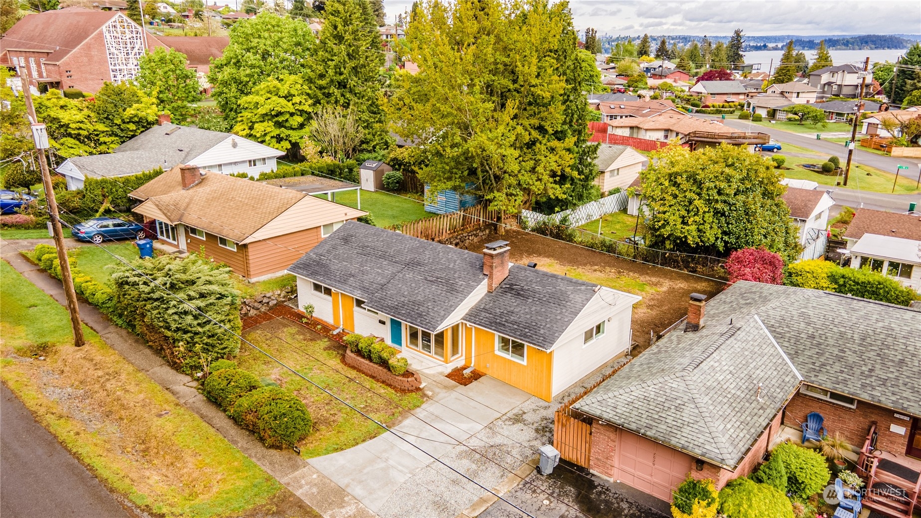 7614 South 113th Street Seattle, WA 98178 - Photo 9 of 24 an aerial view of residential houses with outdoor space