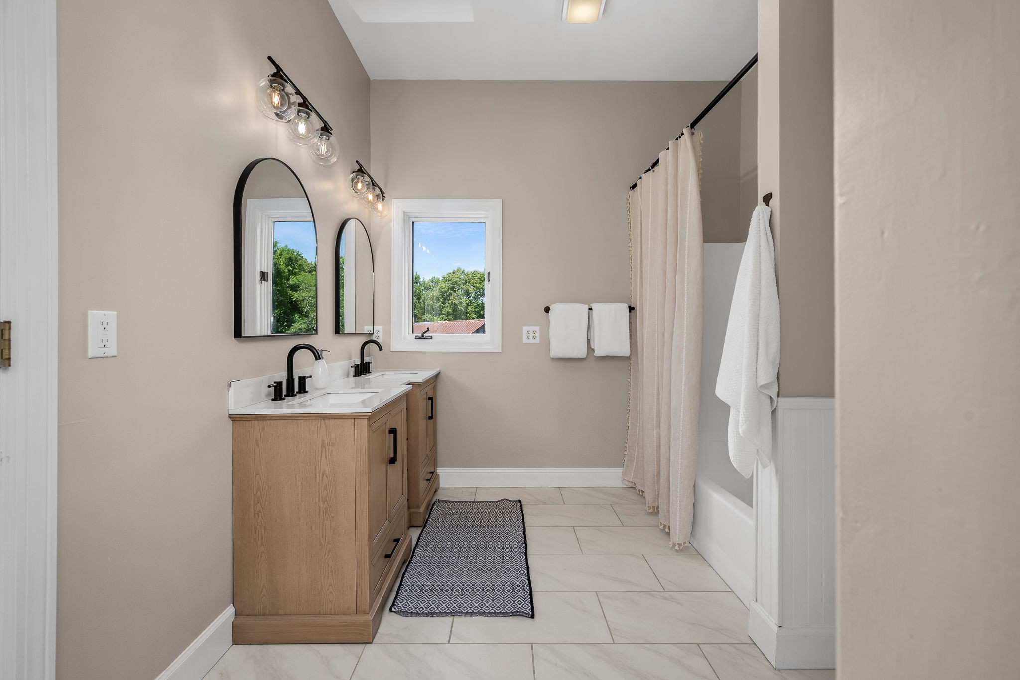 250 Home Pl Road Dickson, TN 37055 - Photo 21 of 62 a bathroom with a double vanity sink and a mirror