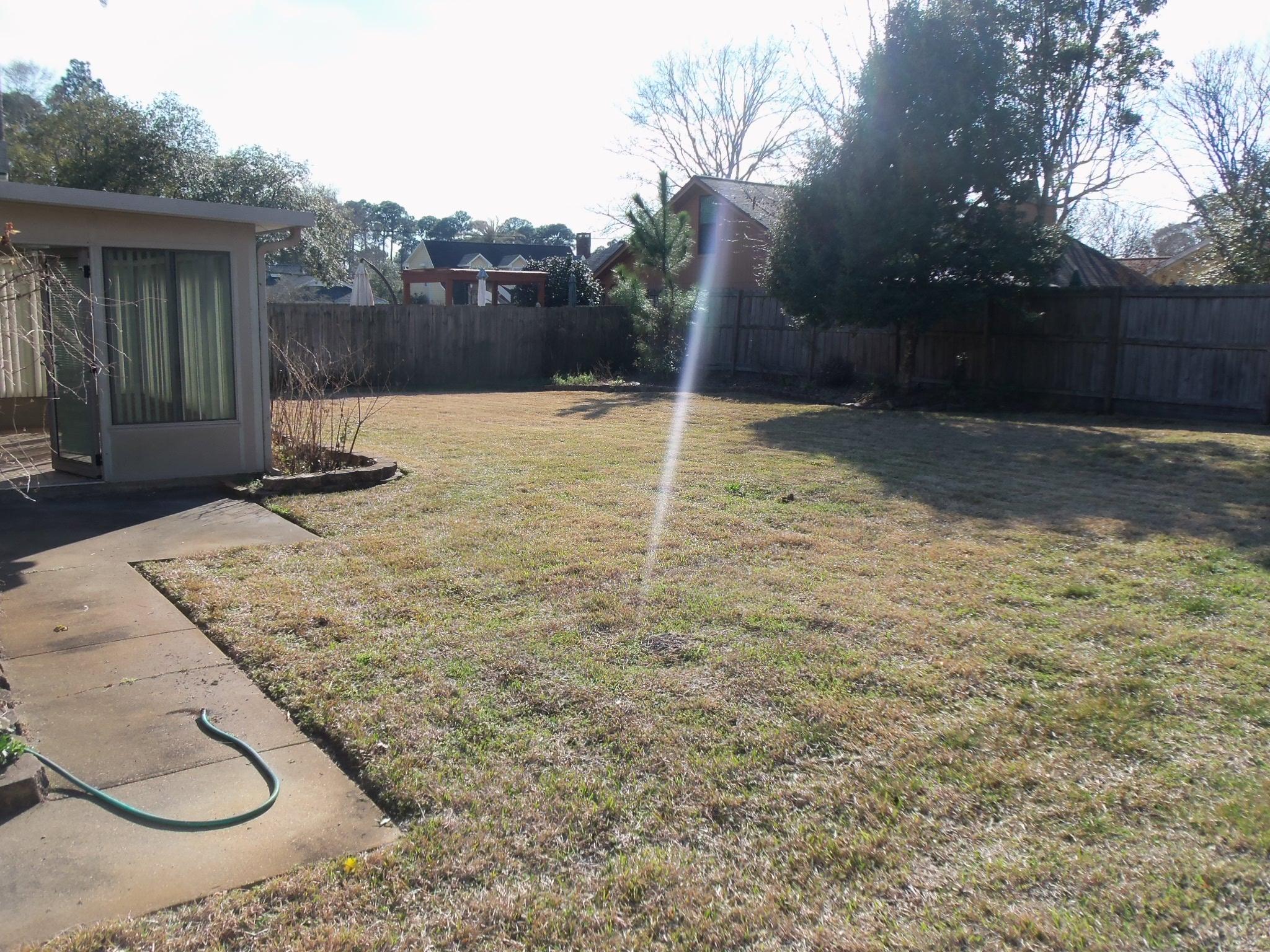 245 Elliott Road Mary Esther, FL 32569 - Photo 11 of 13 a backyard of a house with lots of green space
