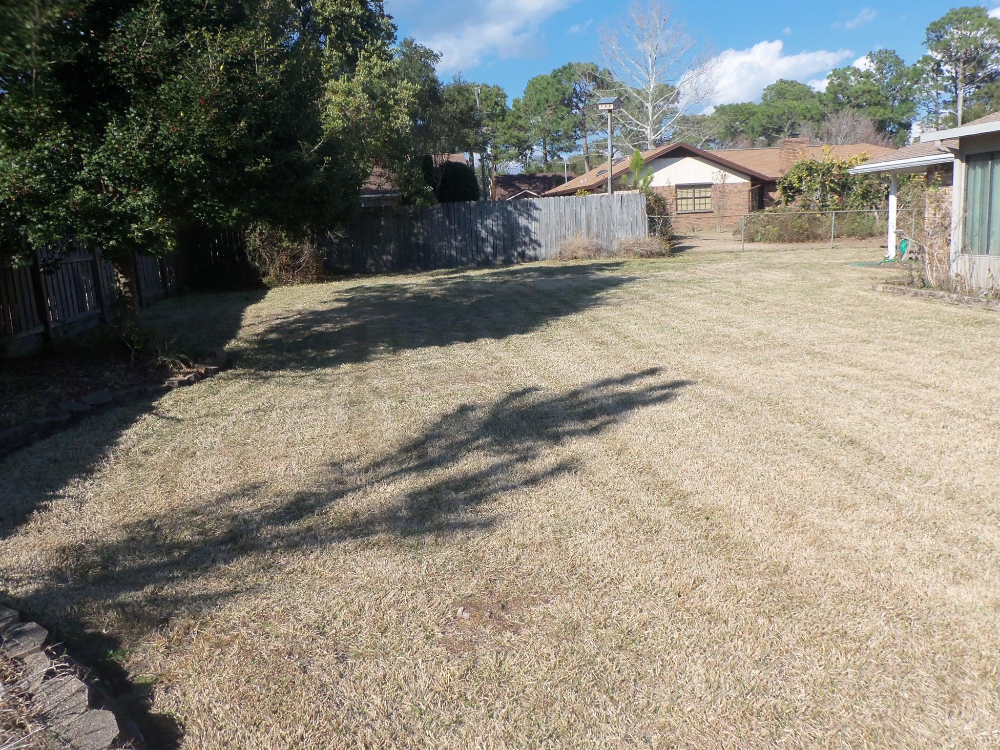 245 Elliott Road Mary Esther, FL 32569 - Photo 12 of 13 a view of a house with a yard