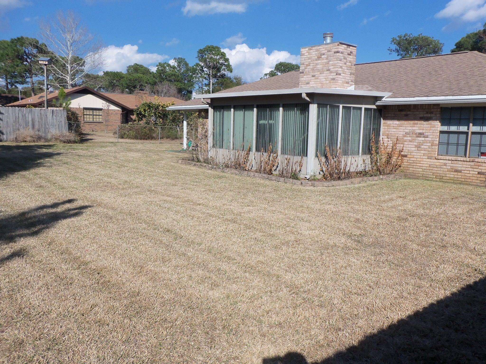 245 Elliott Road Mary Esther, FL 32569 - Photo 13 of 13 a view of a house with a patio