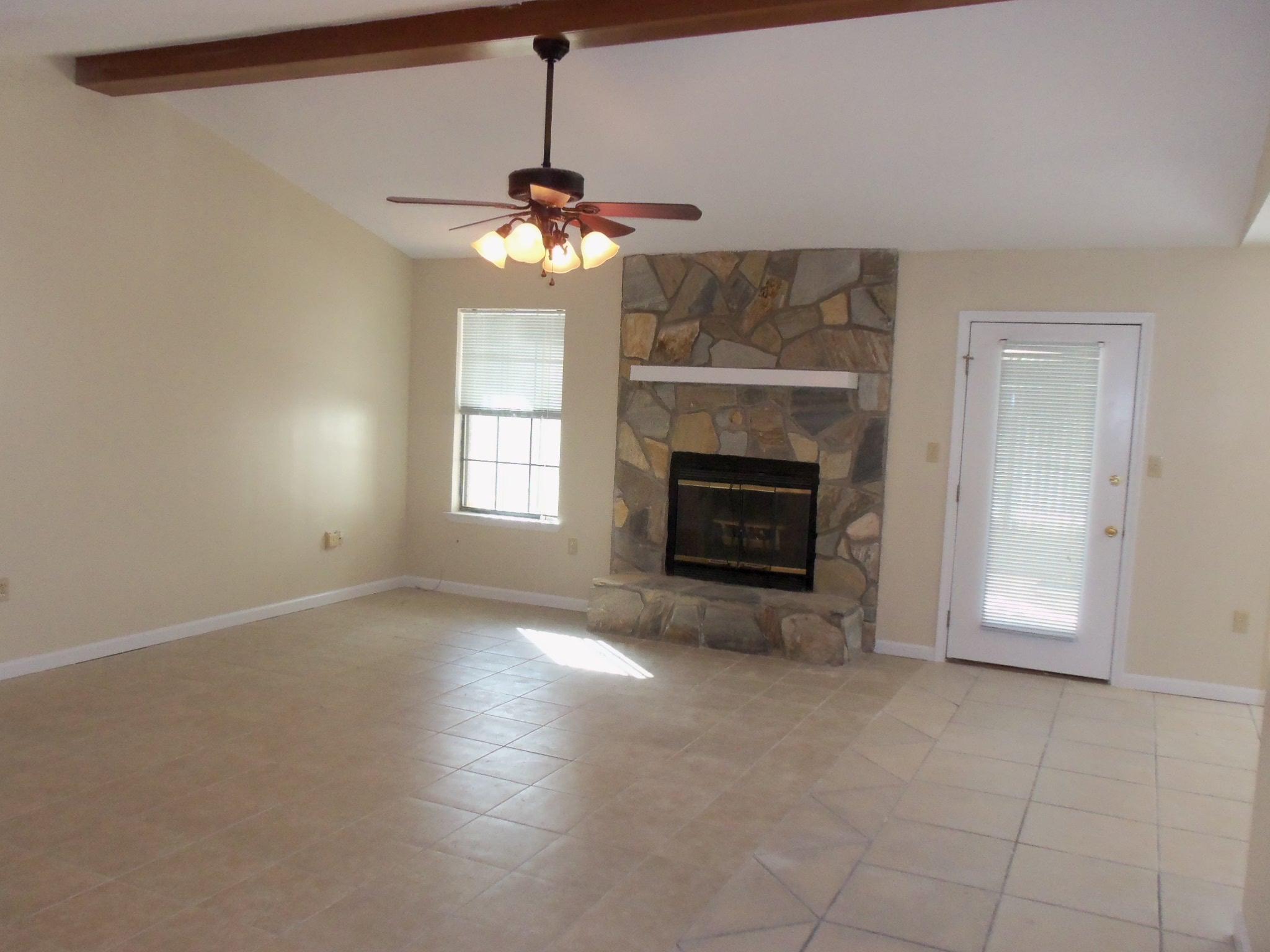 245 Elliott Road Mary Esther, FL 32569 - Photo 2 of 13 a view of an empty room with a fireplace and a window