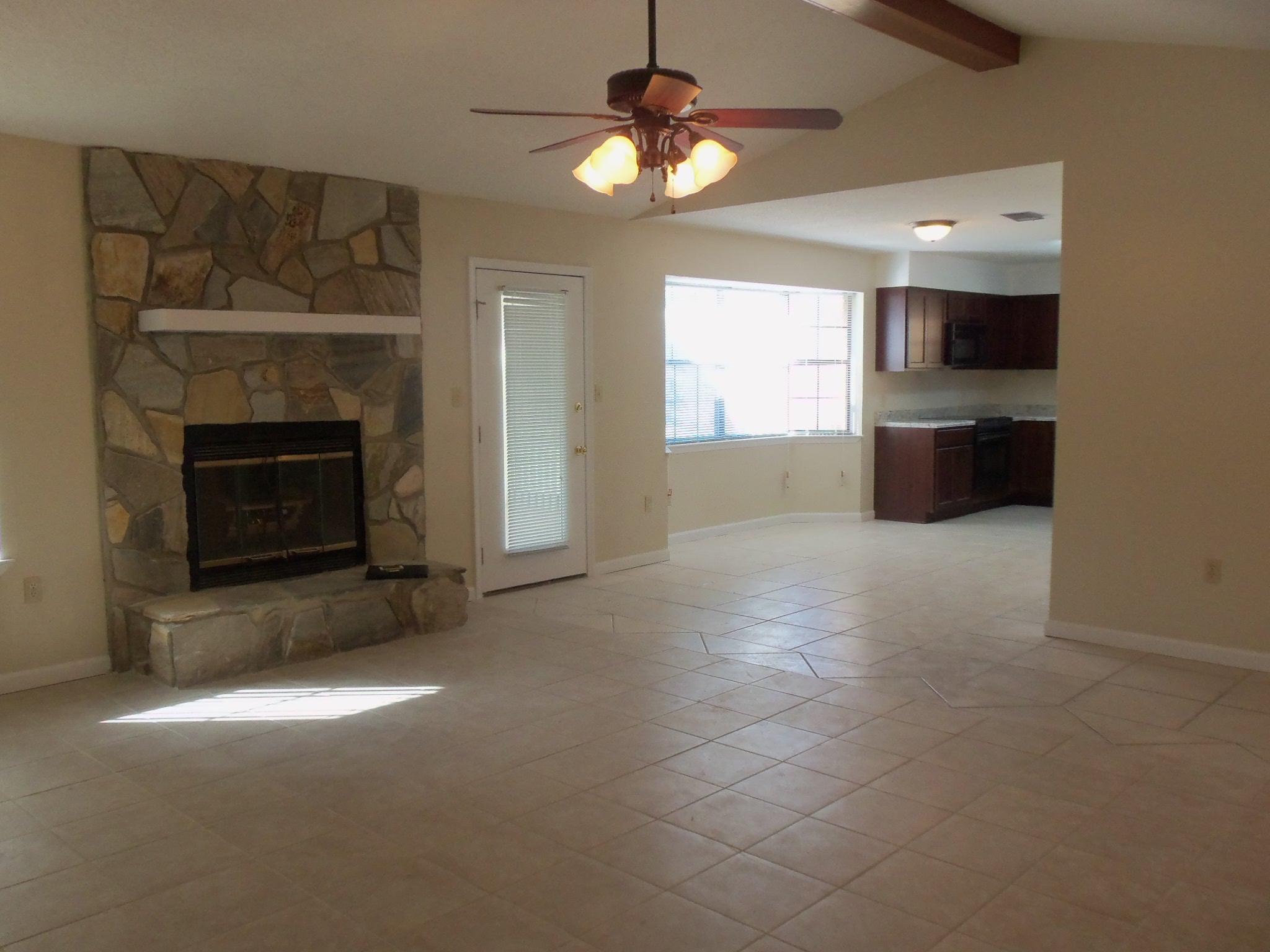 245 Elliott Road Mary Esther, FL 32569 - Photo 4 of 13 a view of a kitchen and a fireplace cabinet screen