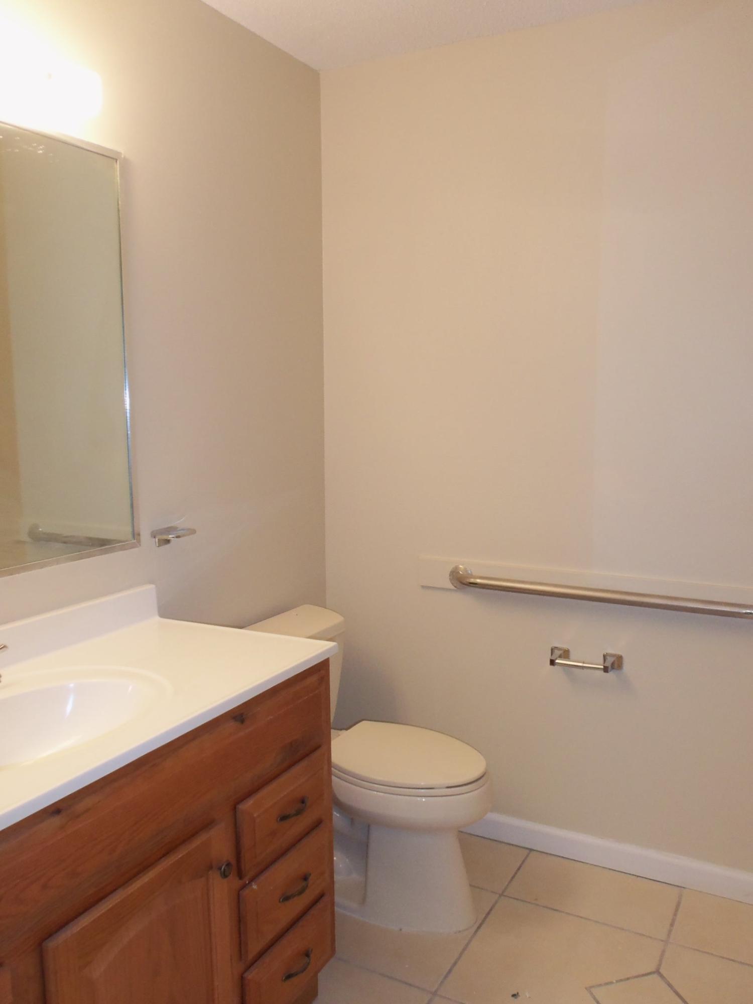 245 Elliott Road Mary Esther, FL 32569 - Photo 10 of 13 a bathroom with a sink a toilet and vanity