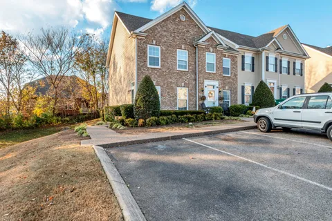 a city street lined with buildings and cars