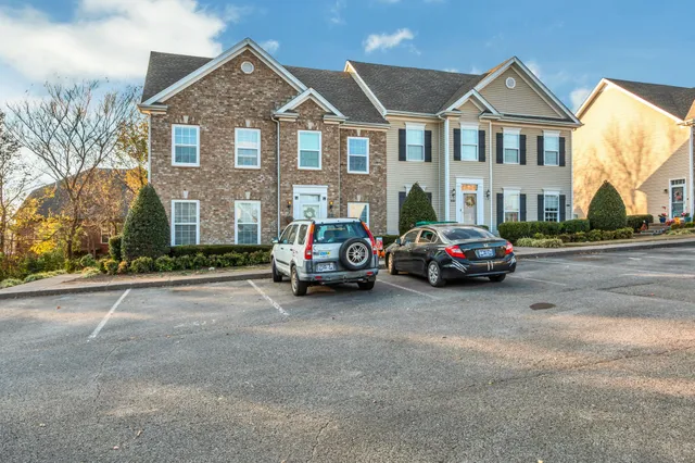 a view of multiple houses with a street