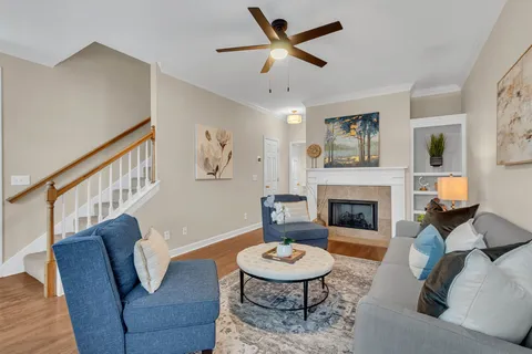 a living room with furniture and a fireplace