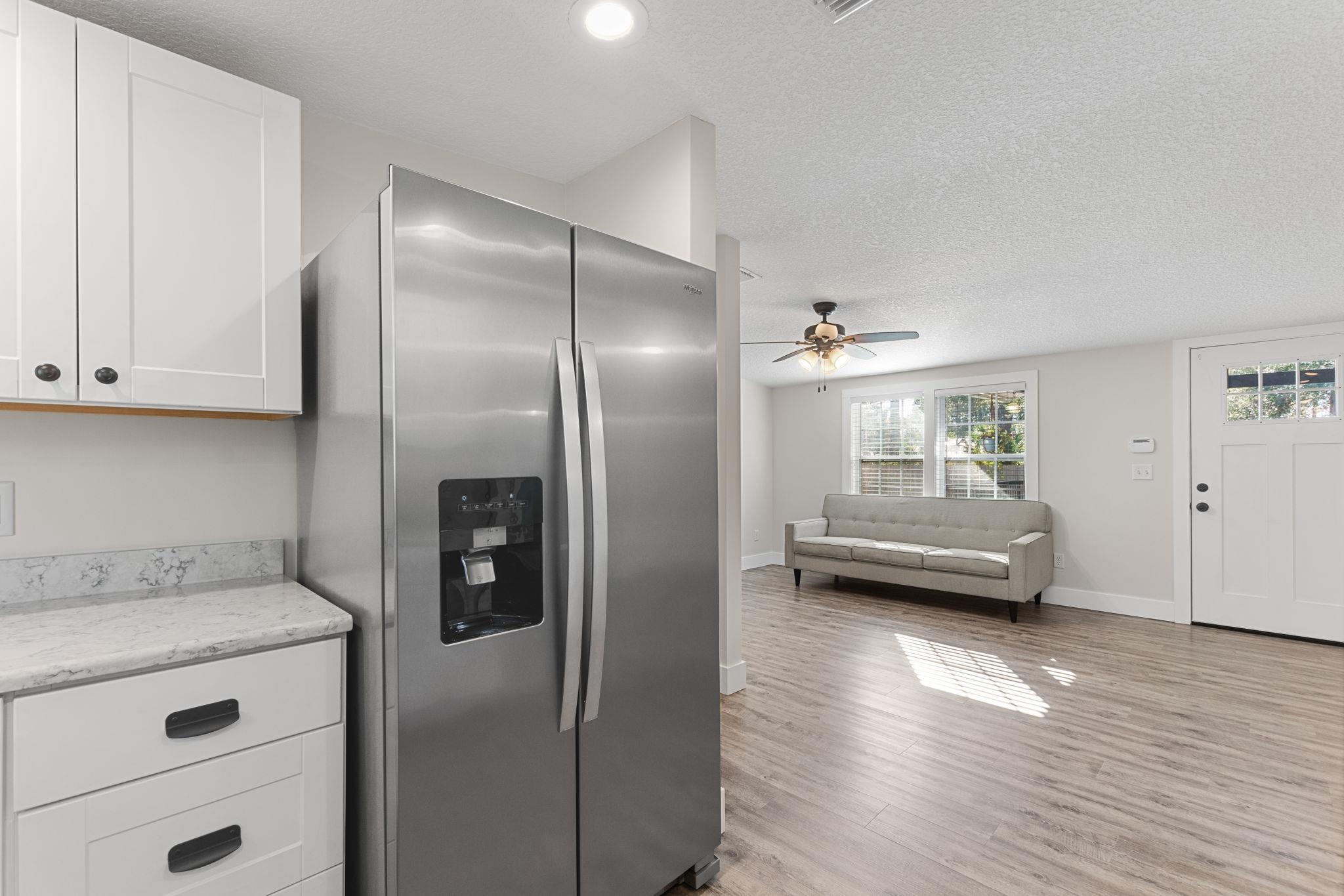 1385 Highland Boulevard St. Augustine, FL 32084 - Photo 12 of 47 a view of kitchen with stainless steel appliances granite countertop a refrigerator and cabinets