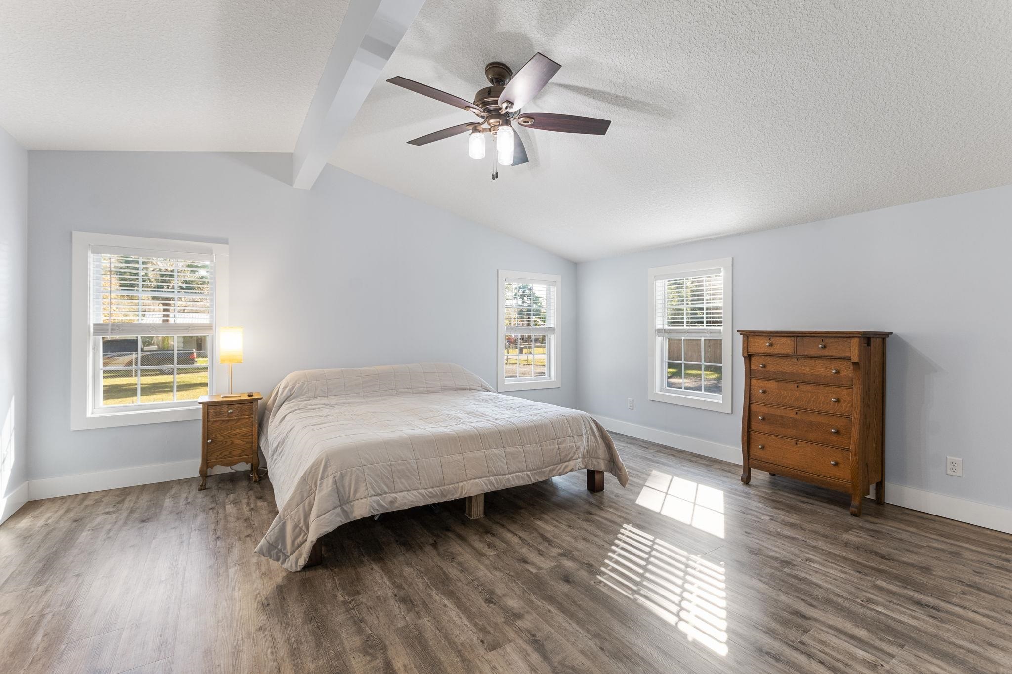 1385 Highland Boulevard St. Augustine, FL 32084 - Photo 16 of 47 a bedroom with a bed and wooden floor