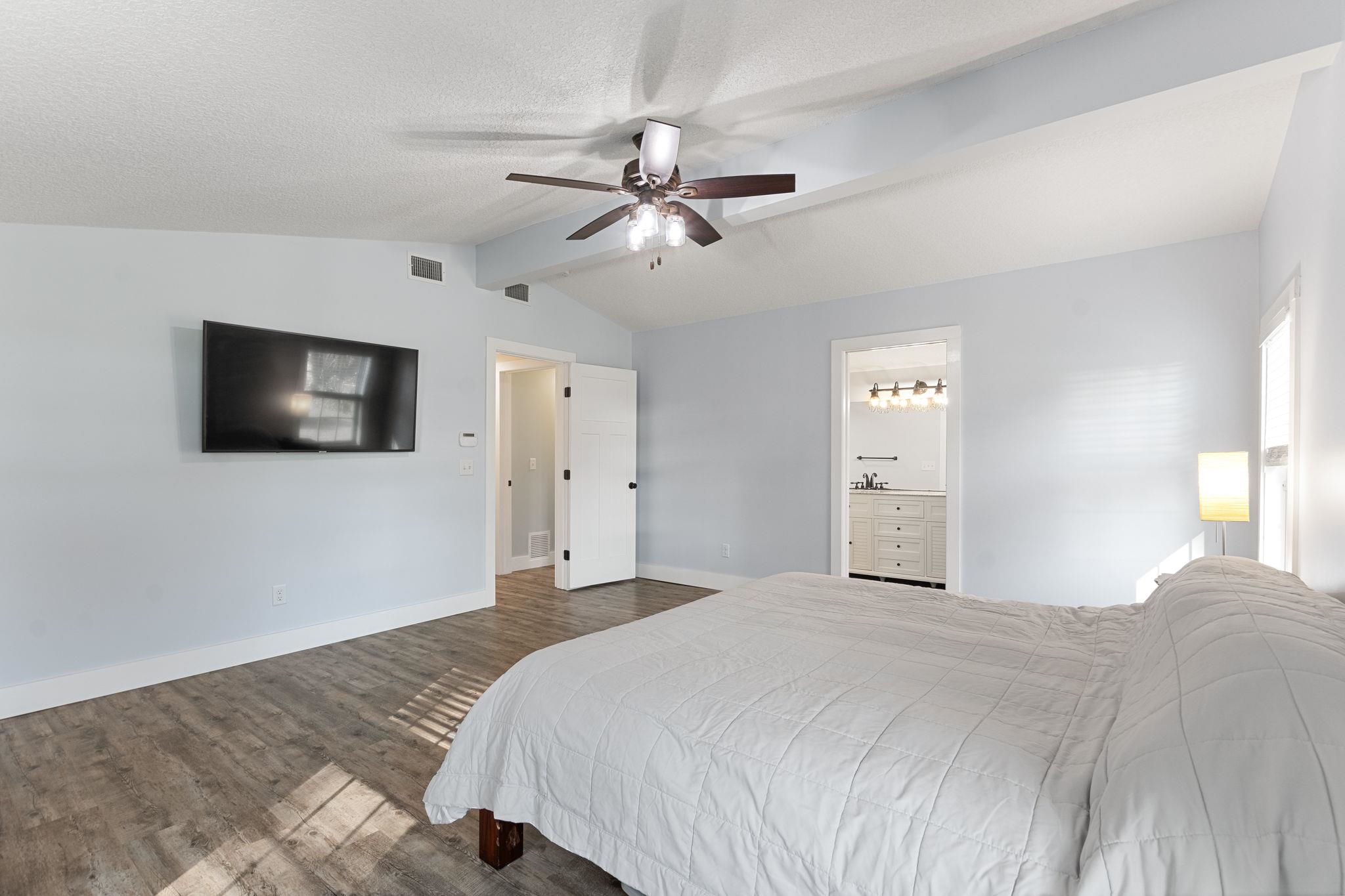 1385 Highland Boulevard St. Augustine, FL 32084 - Photo 18 of 47 a bedroom with a bed and a flat screen tv