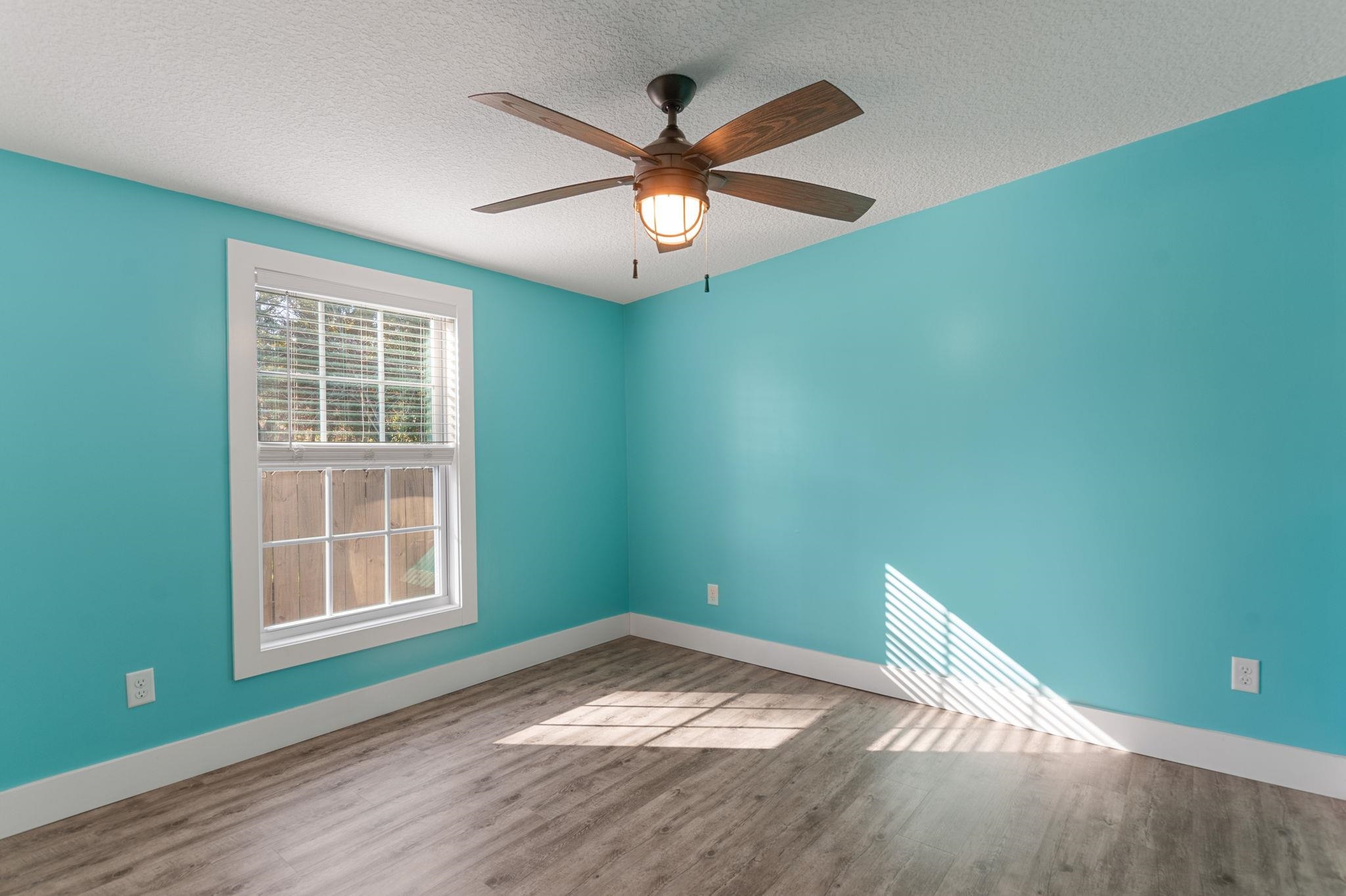 1385 Highland Boulevard St. Augustine, FL 32084 - Photo 26 of 47 a view of empty room with wooden floor and fan