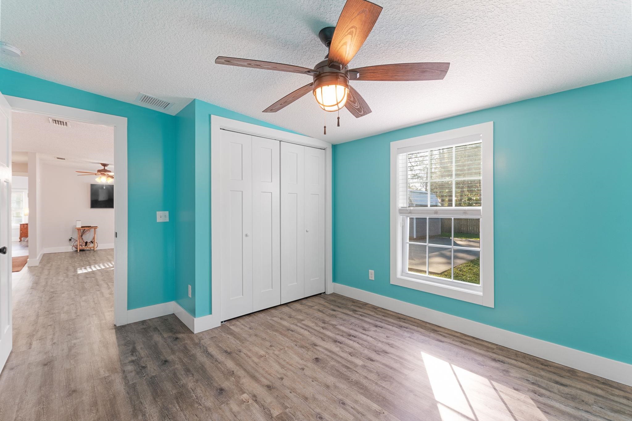 1385 Highland Boulevard St. Augustine, FL 32084 - Photo 27 of 47 wooden floor in an empty room with a window