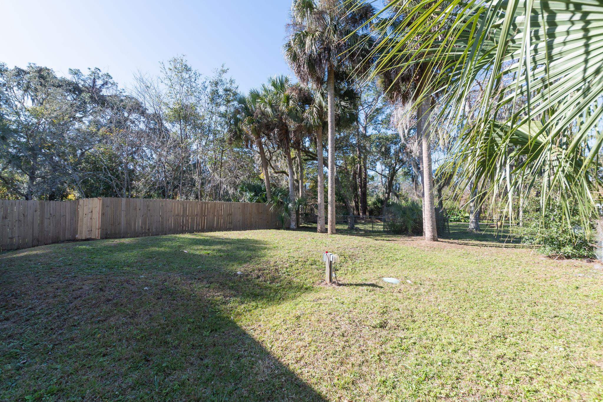 1385 Highland Boulevard St. Augustine, FL 32084 - Photo 41 of 47 a view of a yard with a tree