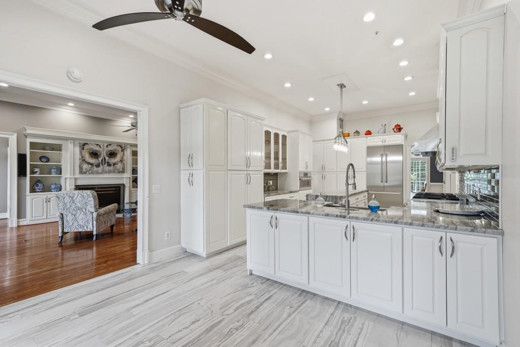 774 Bray Road Southwest Calhoun, GA 30701 - Photo 20 of 106 a kitchen with stainless steel appliances granite countertop a sink and cabinets