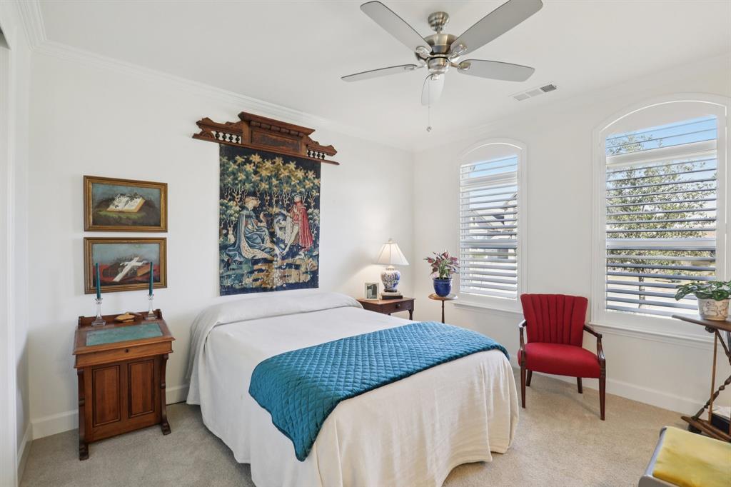 9716 Silver Rock Way Denton, TX 76207 - Photo 17 of 25 a bedroom with a bed and a chair