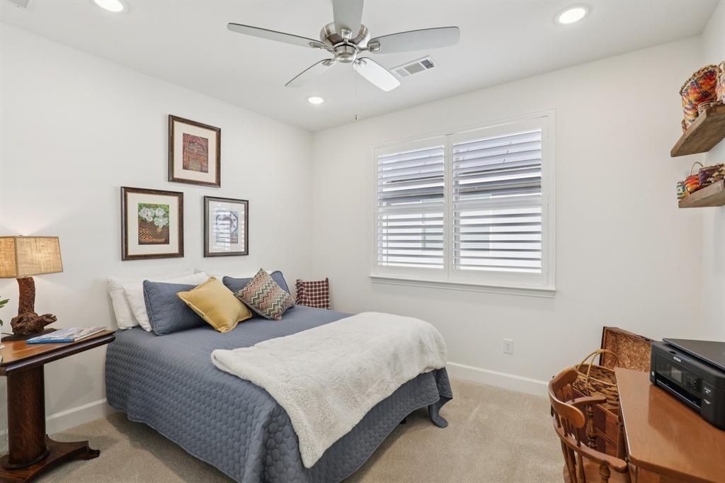 9716 Silver Rock Way Denton, TX 76207 - Photo 18 of 25 a bedroom with a bed and a window