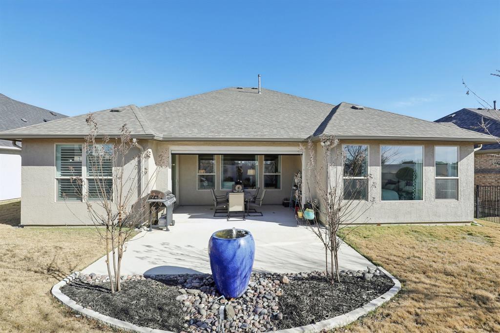 9716 Silver Rock Way Denton, TX 76207 - Photo 20 of 25 a house view with a sitting space fire pit and outdoor space