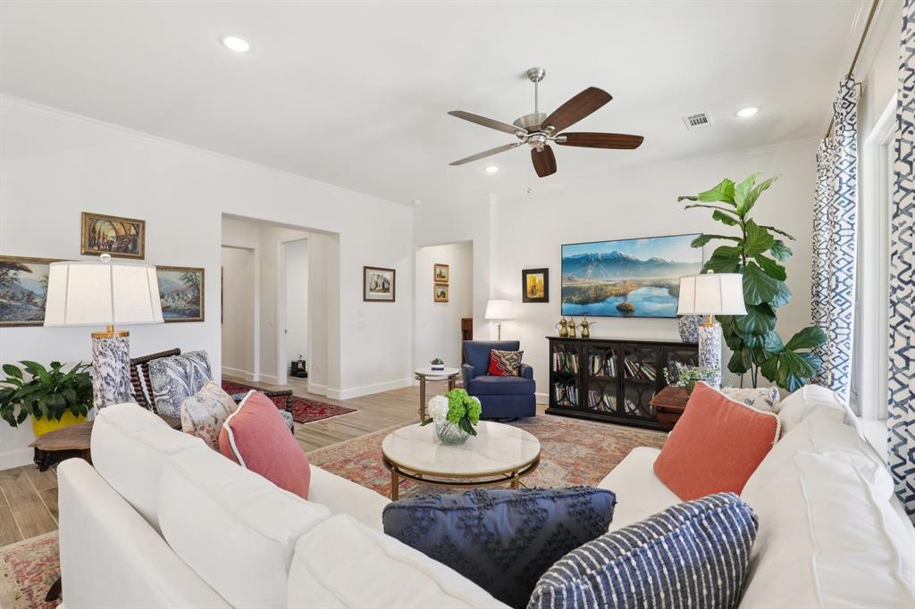 9716 Silver Rock Way Denton, TX 76207 - Photo 4 of 25 a living room with furniture and a table