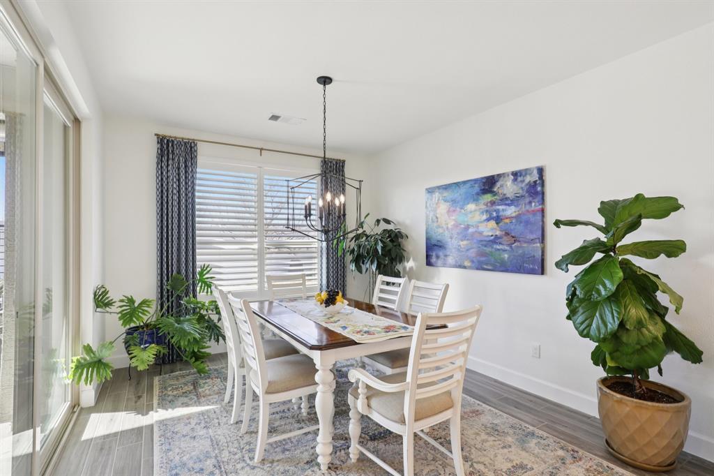 9716 Silver Rock Way Denton, TX 76207 - Photo 10 of 25 a dining room with furniture and potted plant