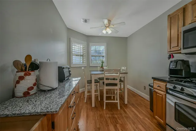 a dining room with furniture and wooden floor