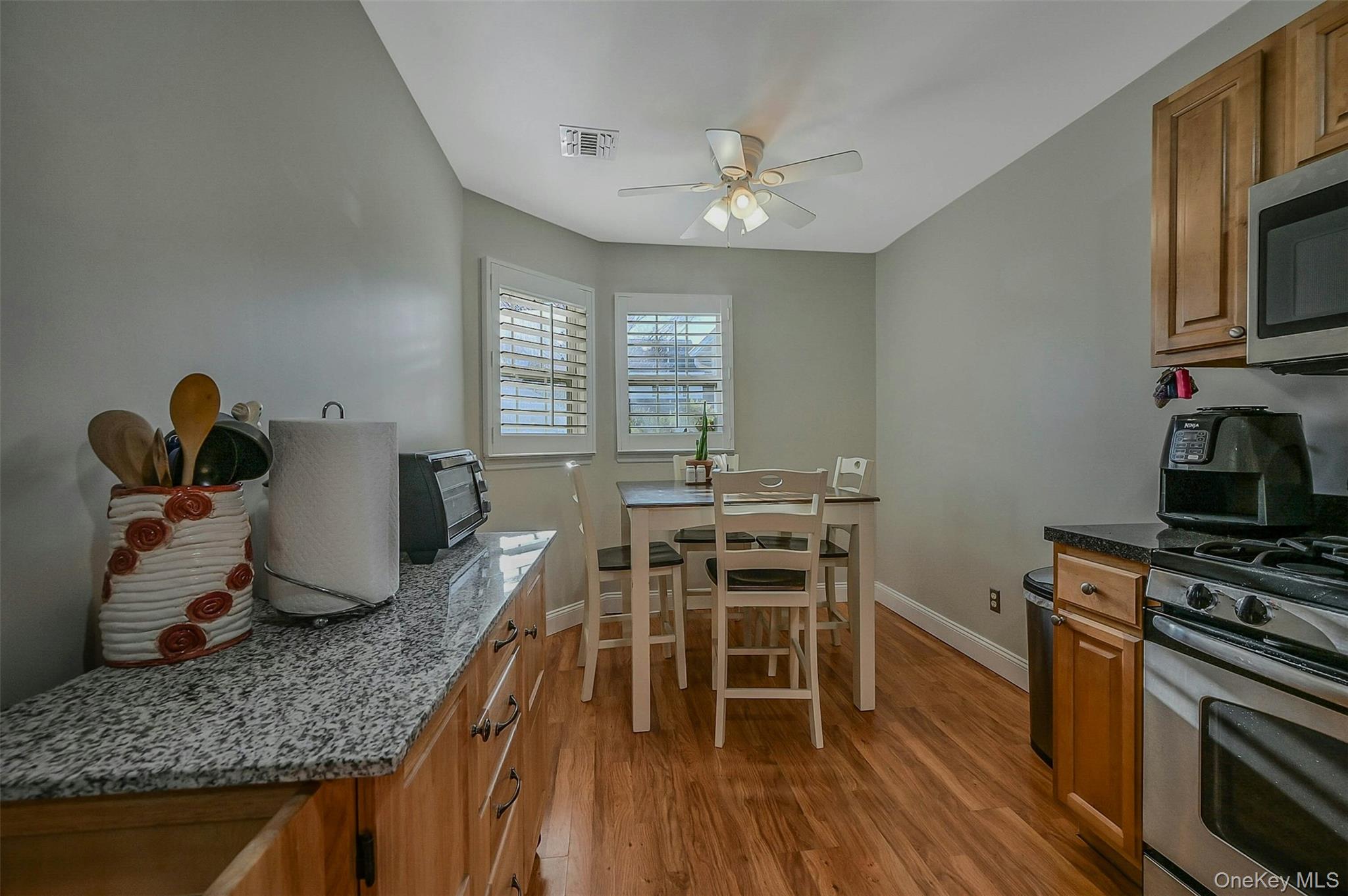 50 Strawberry Commons Riverhead, NY 11901 - Photo 11 of 33 a dining room with furniture and wooden floor