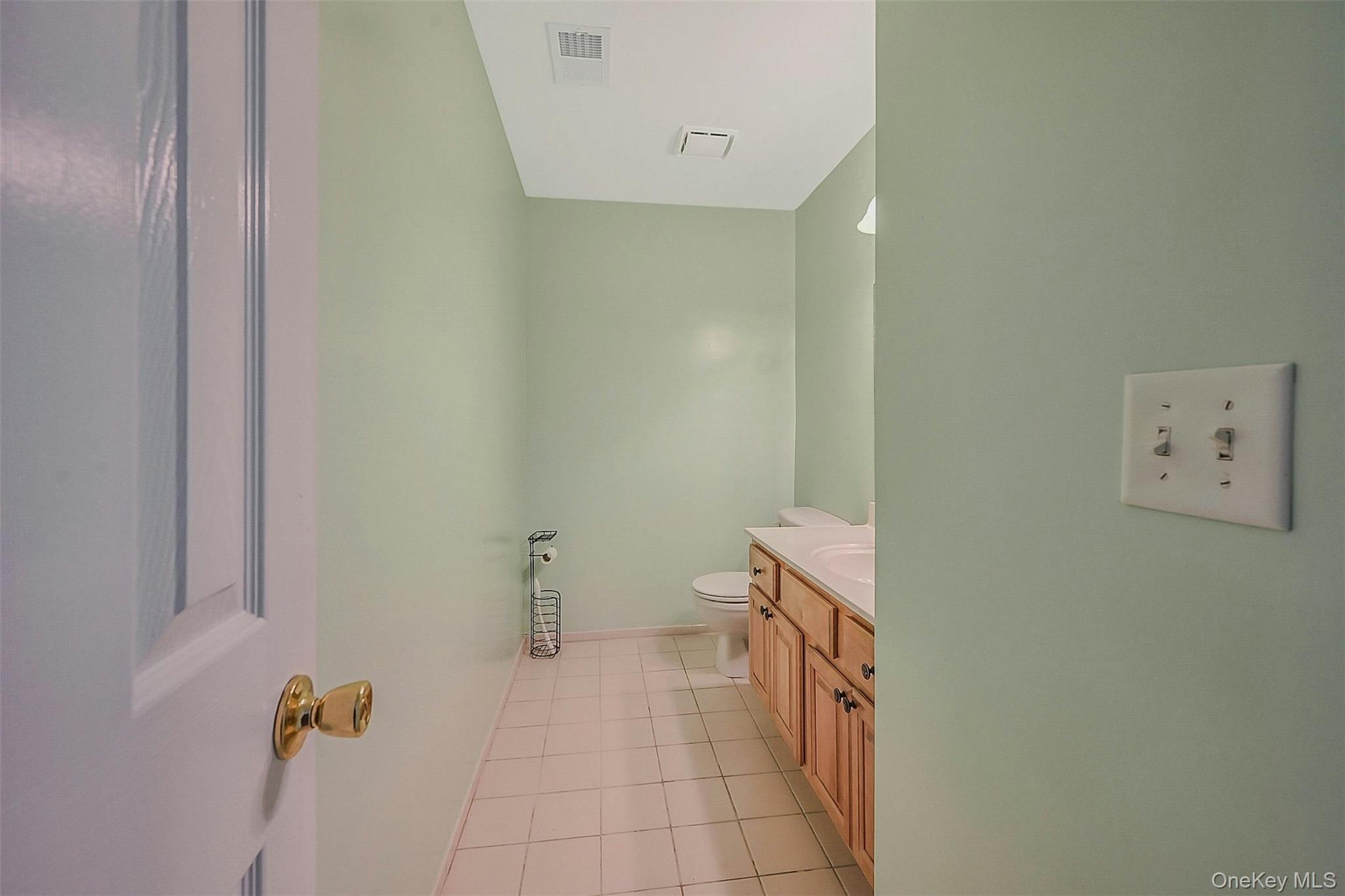 50 Strawberry Commons Riverhead, NY 11901 - Photo 13 of 33 a bathroom with a toilet