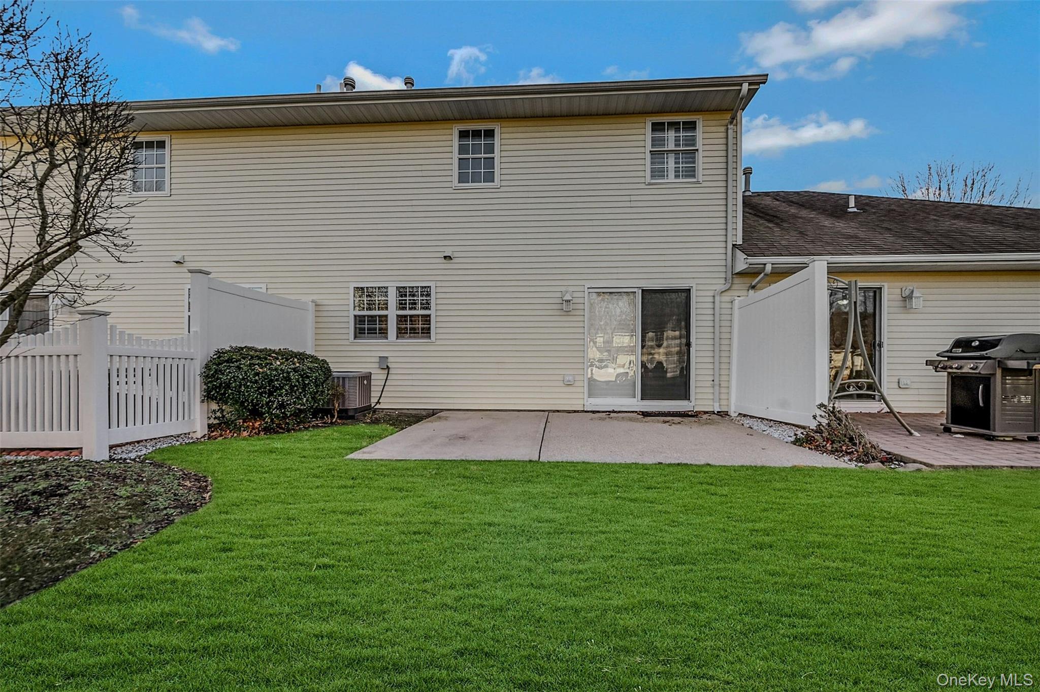 50 Strawberry Commons Riverhead, NY 11901 - Photo 27 of 33 a view of a backyard of the house