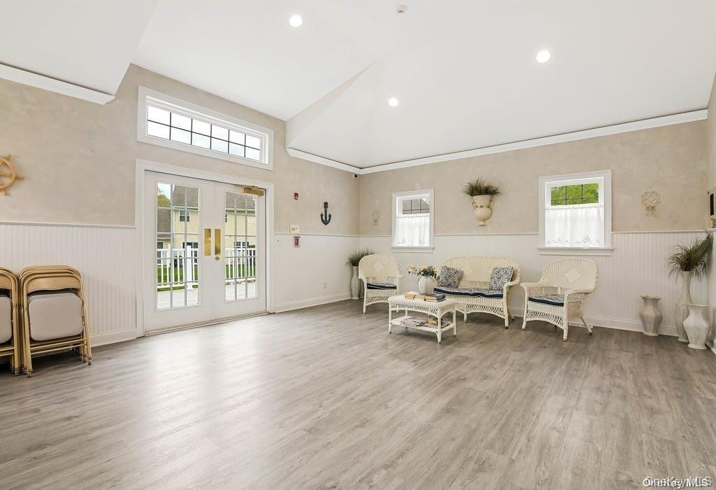 50 Strawberry Commons Riverhead, NY 11901 - Photo 30 of 33 a living room with furniture and wooden floor