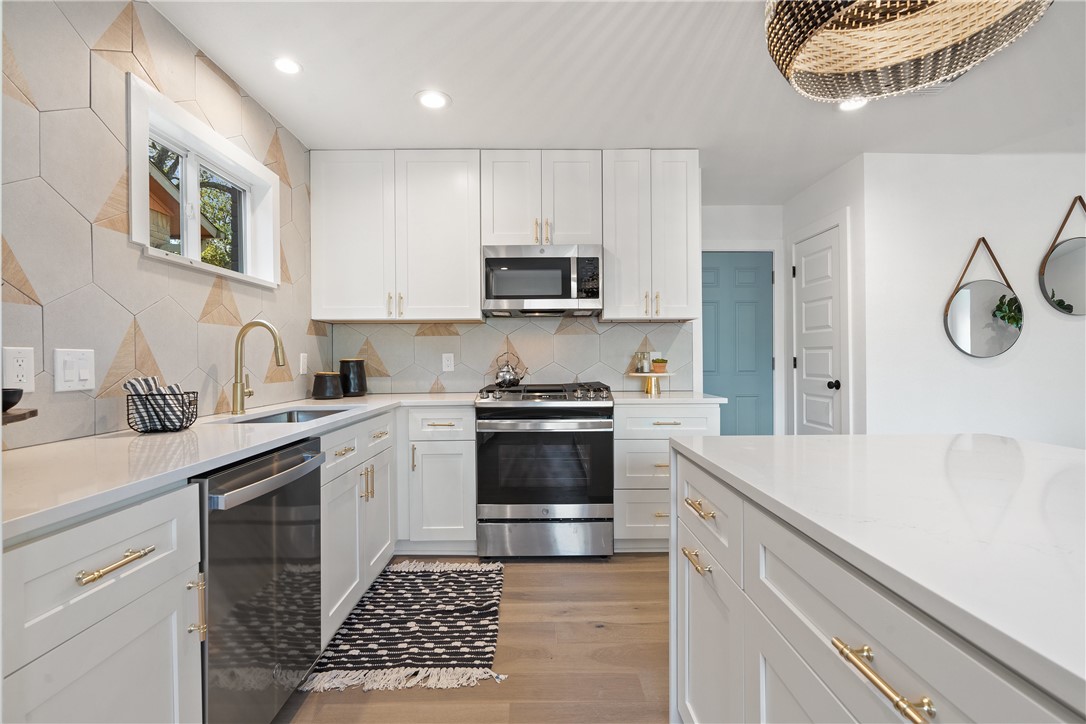 3808 Leafield Drive Austin, TX 78749 - Photo 13 of 31 a kitchen with a sink stove and cabinets