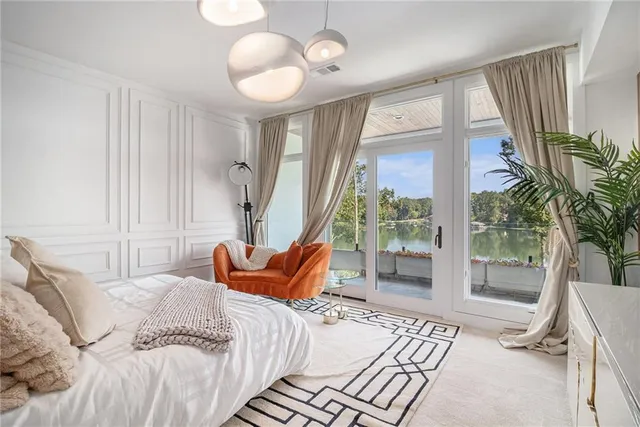 a bedroom with a large bed and a large closet