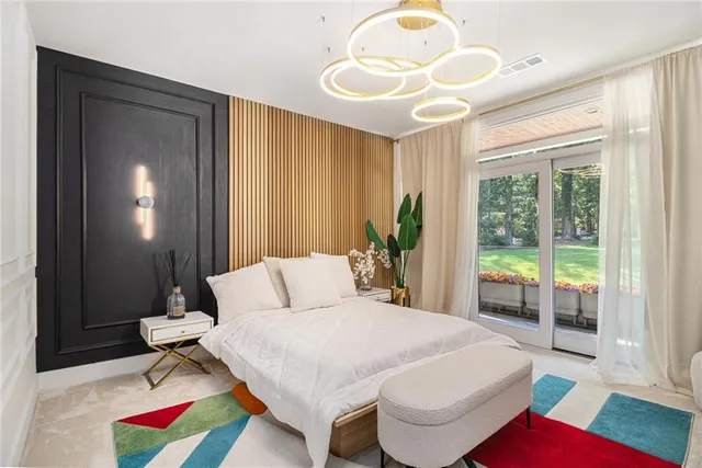 a bedroom with furniture and a potted plant