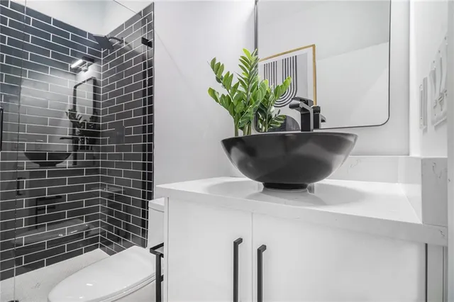 a kitchen with wooden cabinets and a window