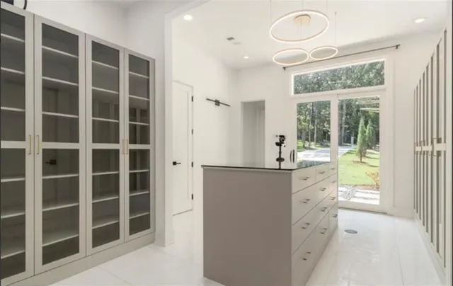 a open kitchen with stainless steel appliances granite countertop a stove a sink dishwasher and cabinets with wooden floor