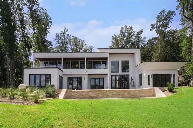 aerial view of a house with swimming pool and porch