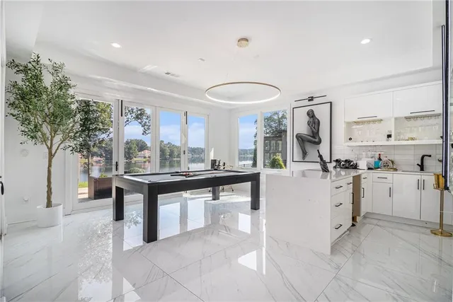 a room with cabinets and painting on the wall