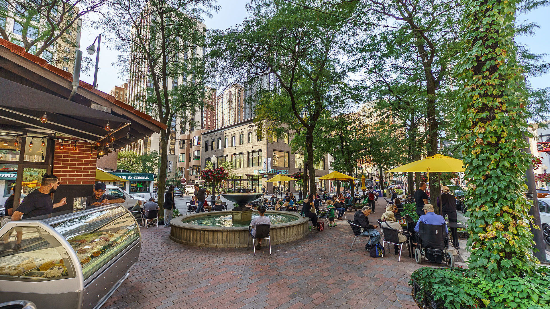 1030 North State Street, Unit 13E Chicago, IL 60610 - Photo 24 of 26 a view of a patio with couches table and chairs and potted plants