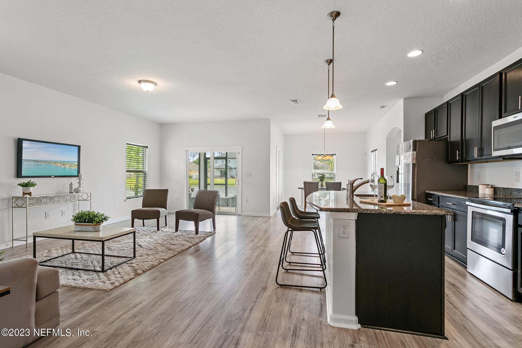 9864 Sailor Drive Jacksonville, FL 32221 - Photo 13 of 44 a view of a dining room with furniture window and wooden floor