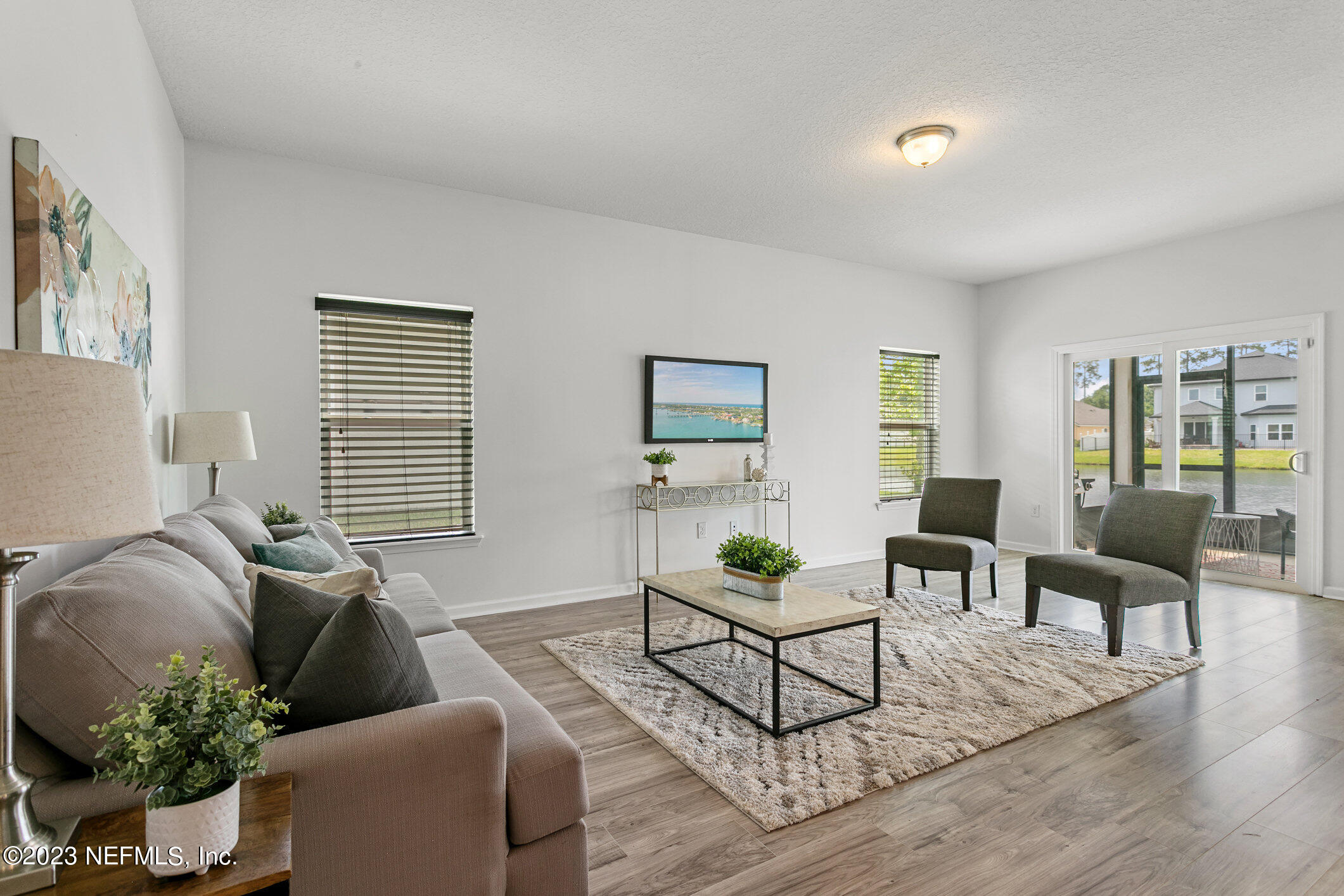 9864 Sailor Drive Jacksonville, FL 32221 - Photo 22 of 44 a living room with furniture and wooden floor