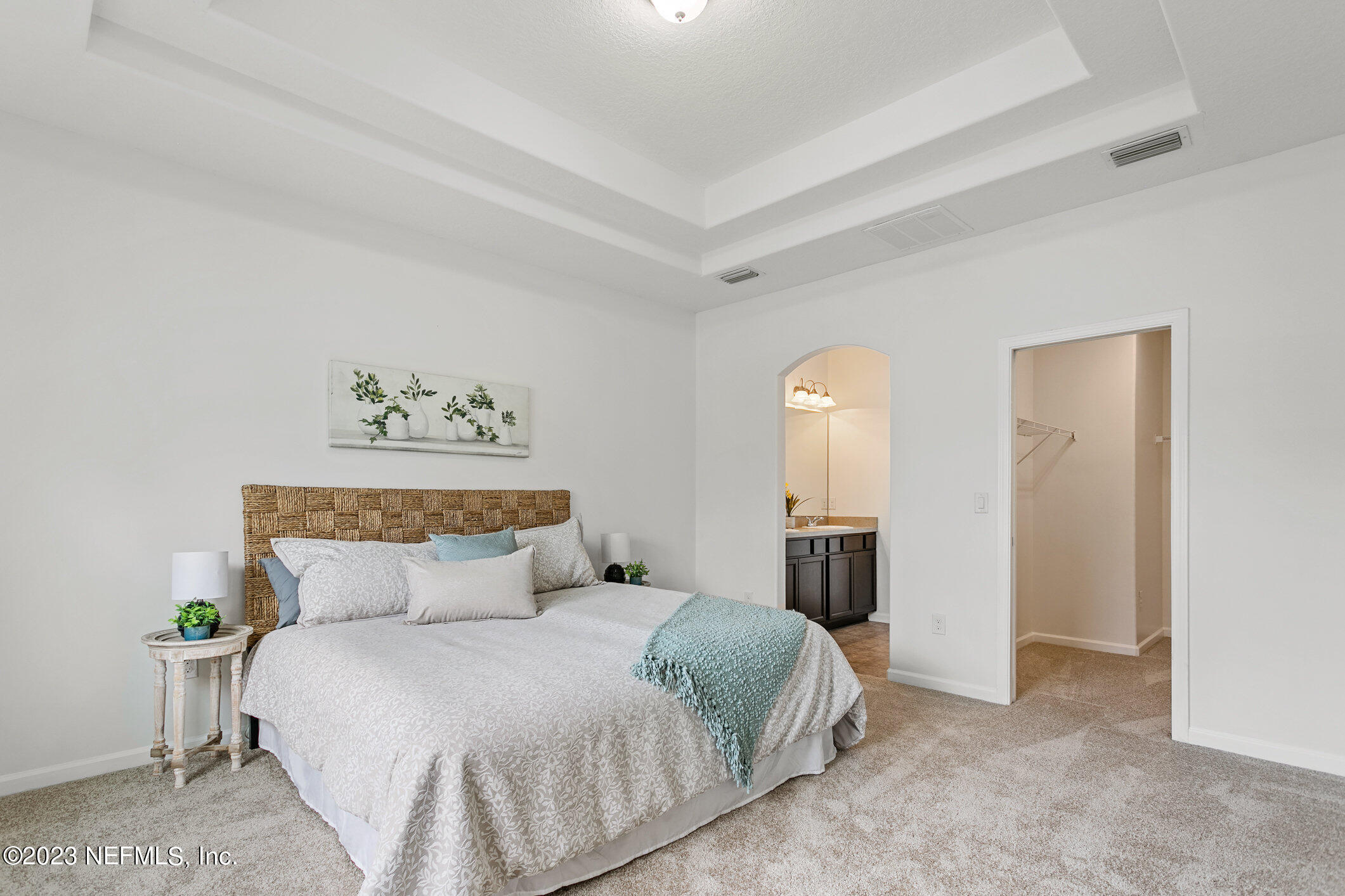 9864 Sailor Drive Jacksonville, FL 32221 - Photo 25 of 44 a bedroom with a bed and a mirror