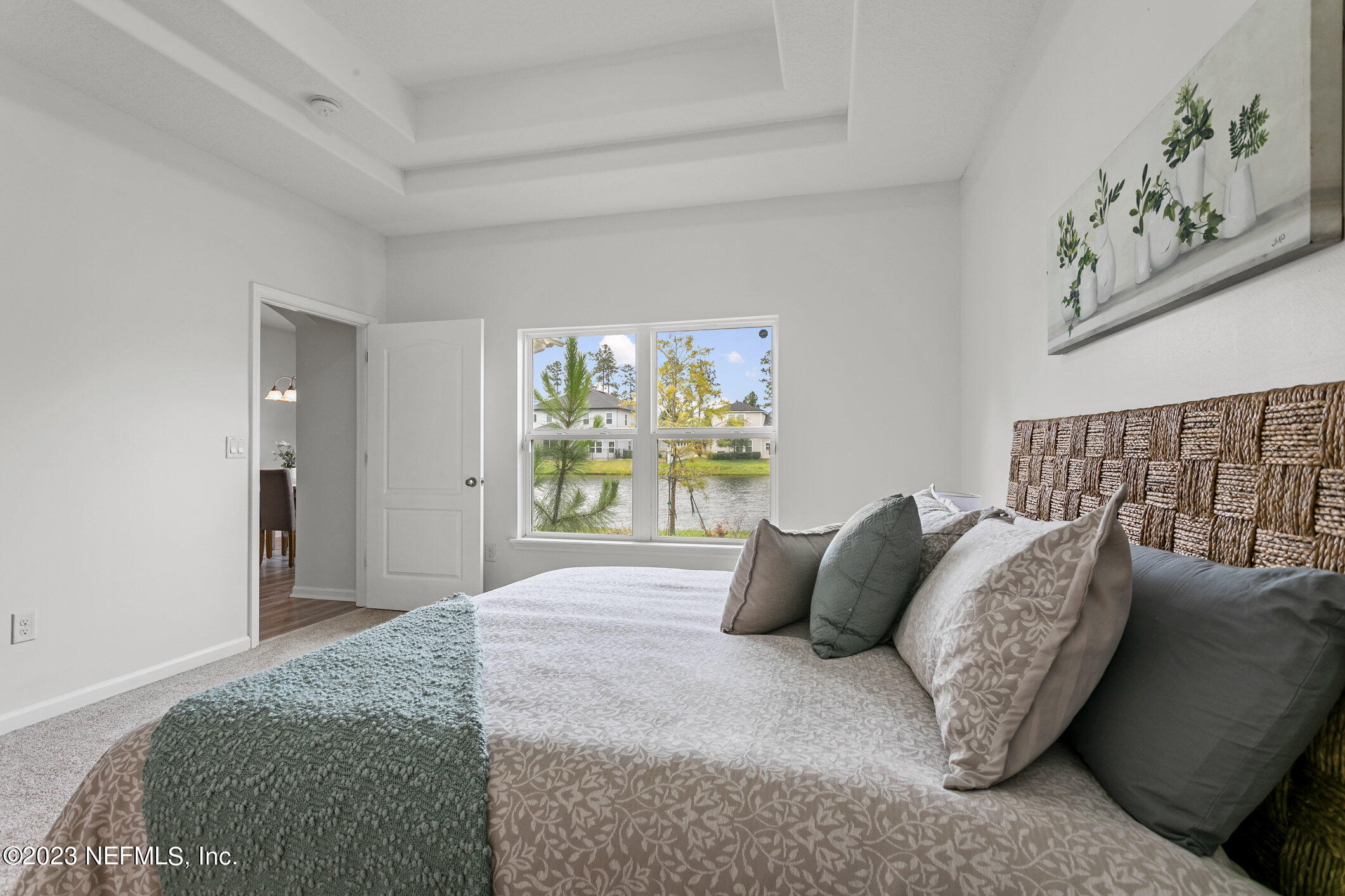 9864 Sailor Drive Jacksonville, FL 32221 - Photo 26 of 44 a bedroom with a bed and a window