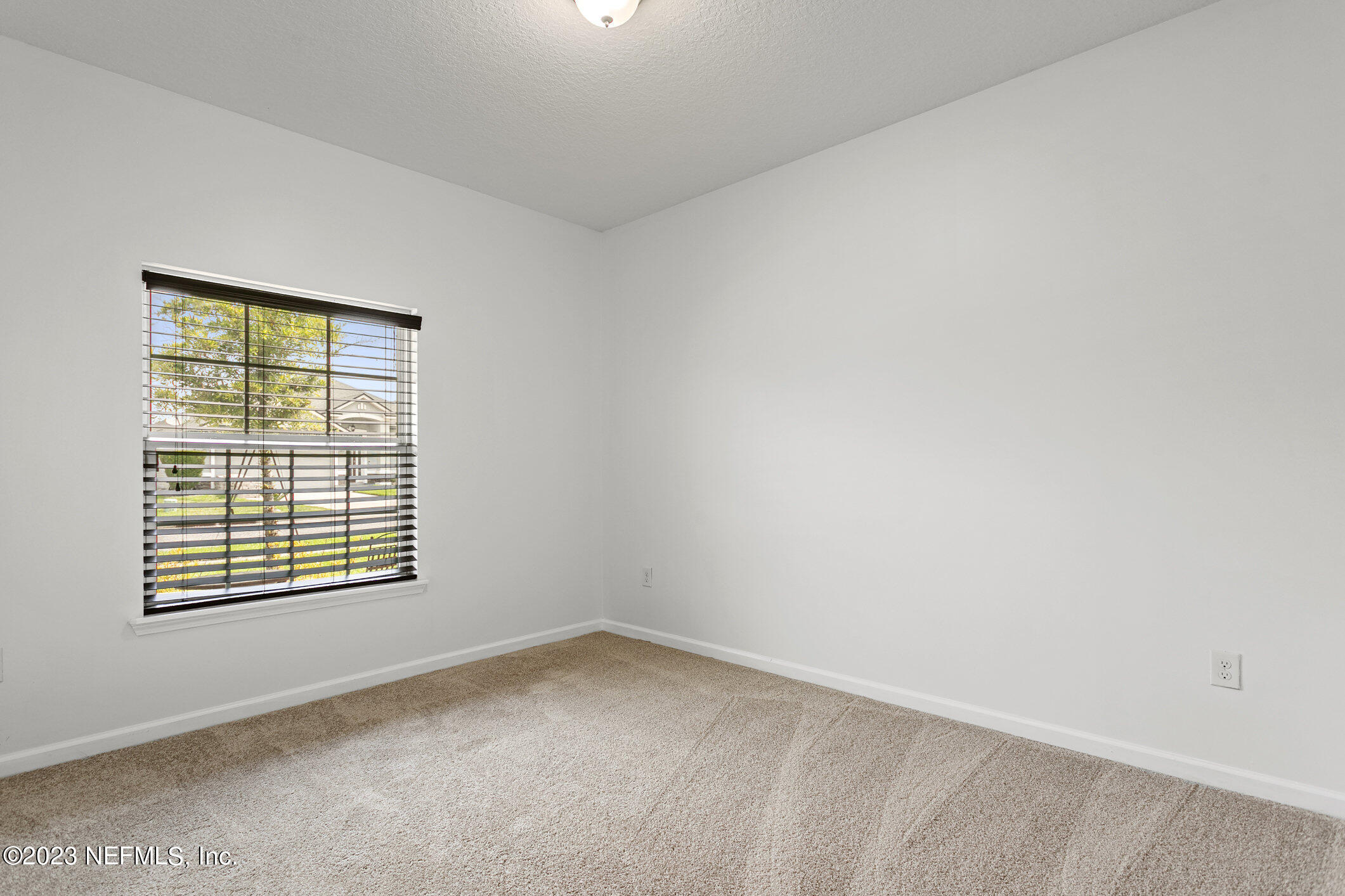 9864 Sailor Drive Jacksonville, FL 32221 - Photo 29 of 44 an empty room with a window