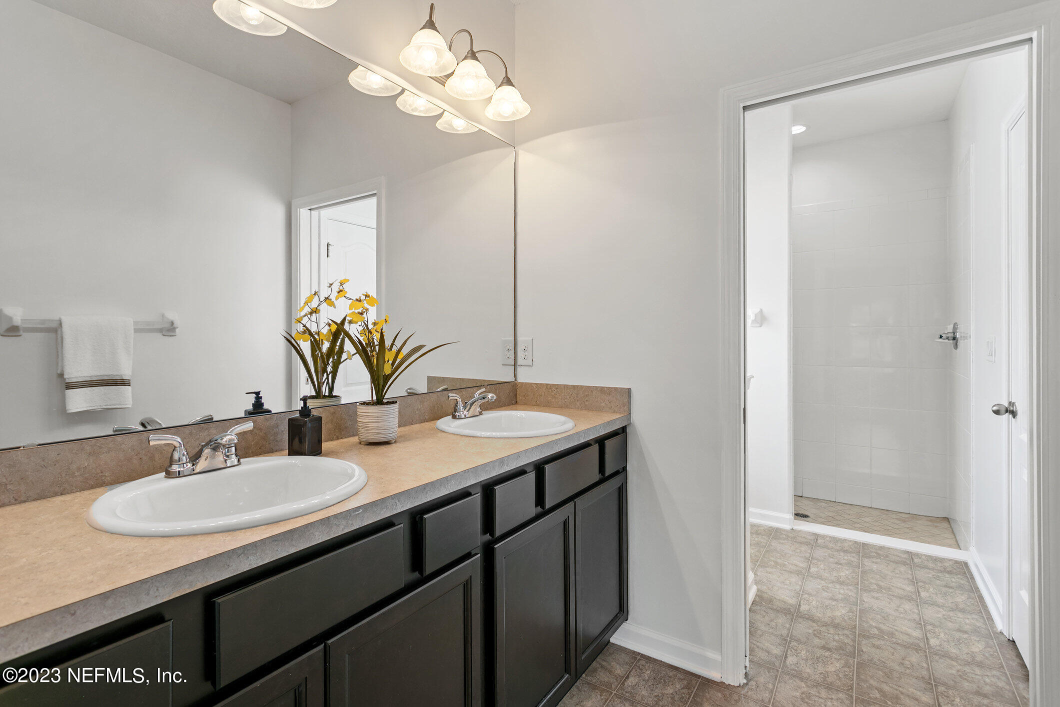 9864 Sailor Drive Jacksonville, FL 32221 - Photo 30 of 44 a bathroom with a sink double vanity and a mirror