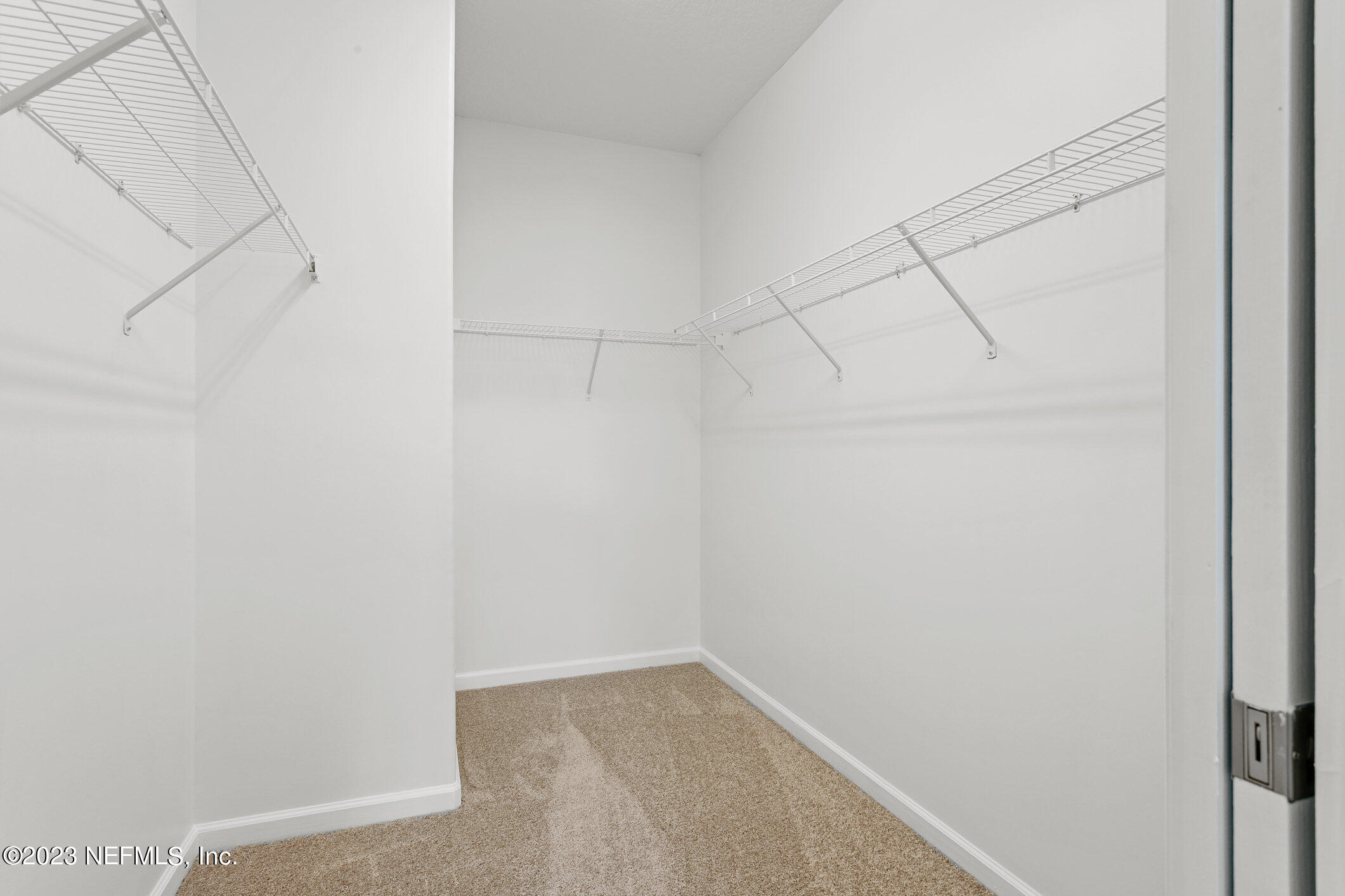 9864 Sailor Drive Jacksonville, FL 32221 - Photo 35 of 44 a view of a room with racks on the wall