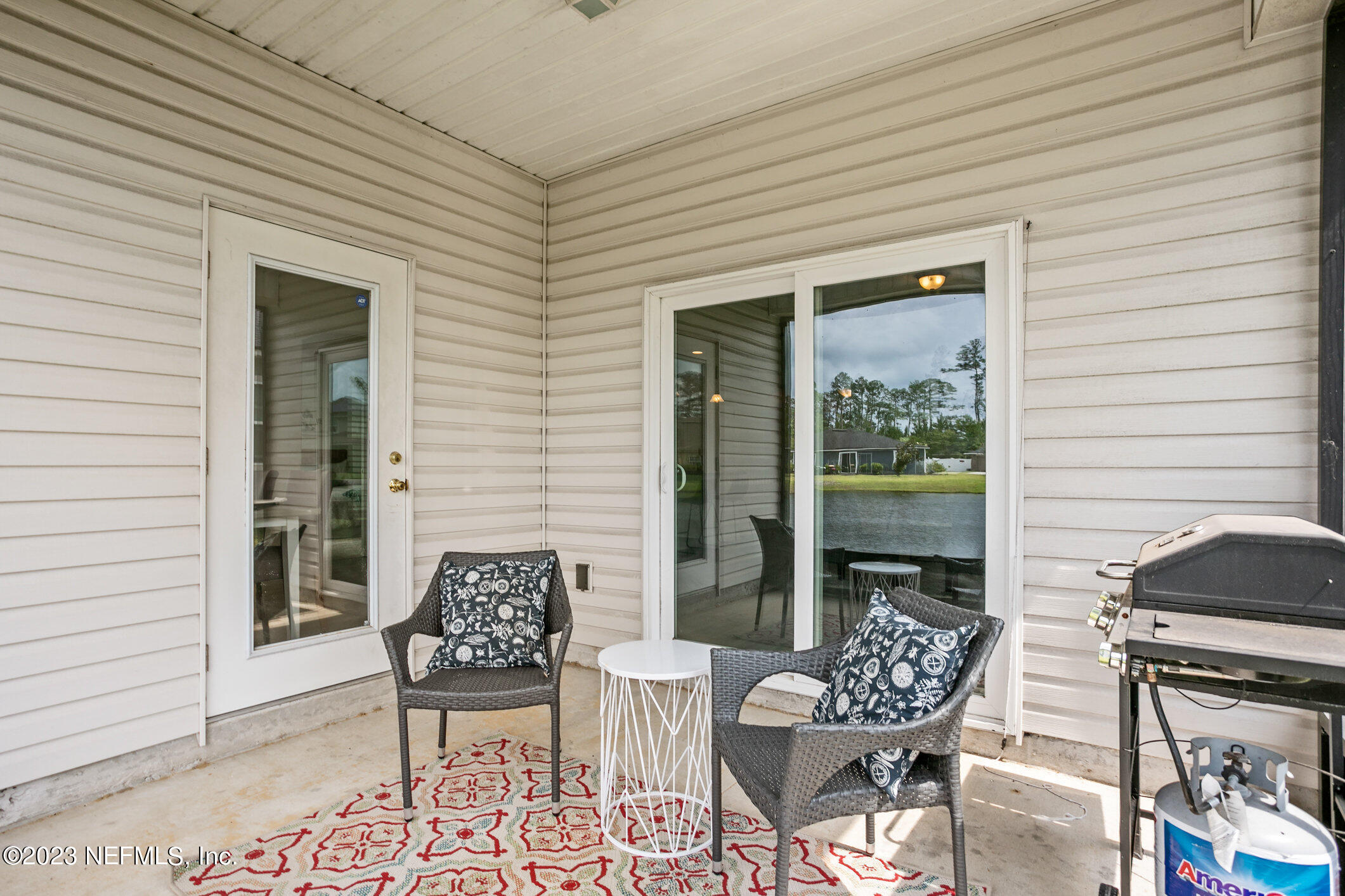 9864 Sailor Drive Jacksonville, FL 32221 - Photo 38 of 44 a balcony with furniture and a potted plant
