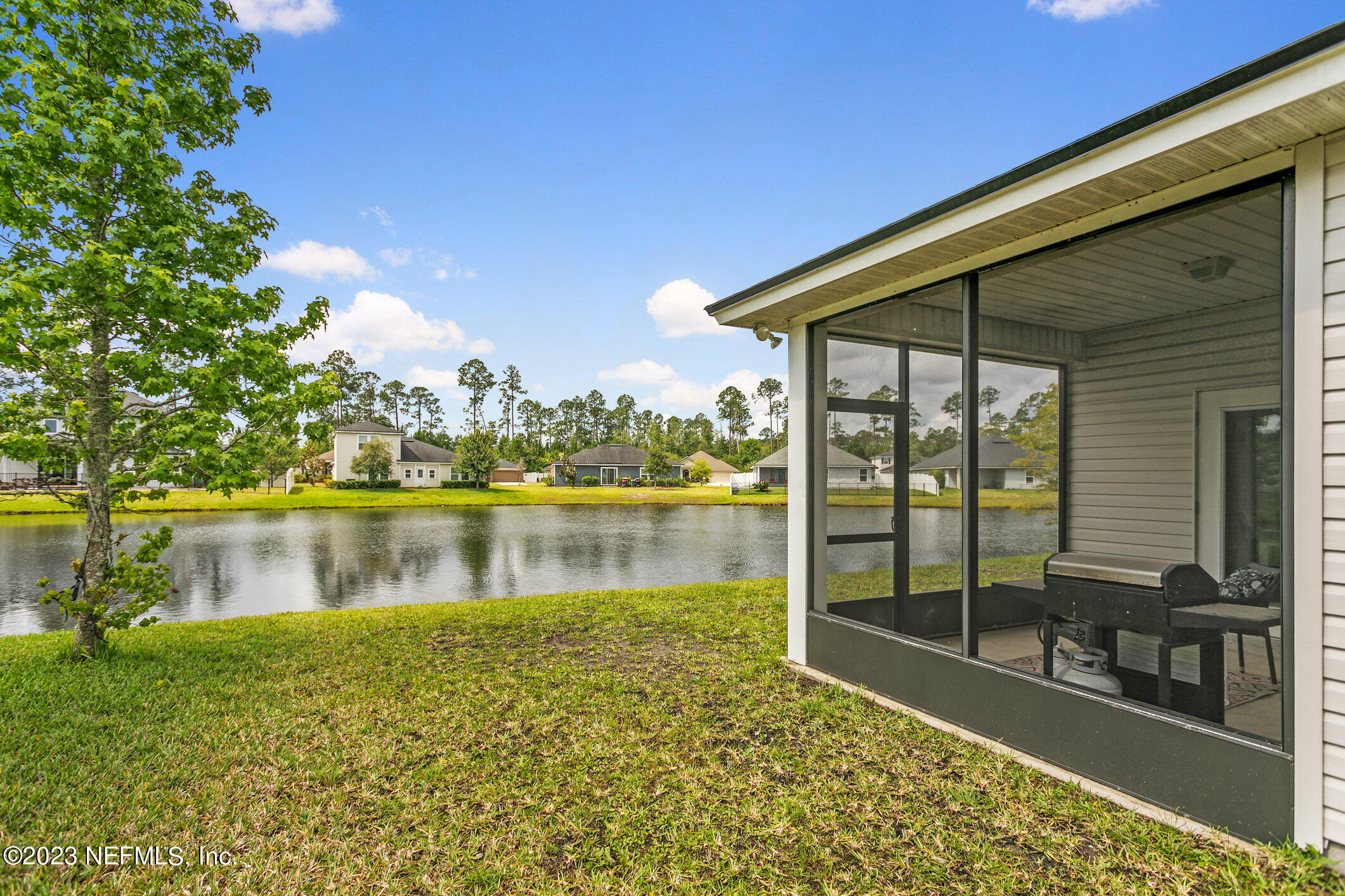 9864 Sailor Drive Jacksonville, FL 32221 - Photo 40 of 44 a view of a lake with a floor to ceiling window and outside view