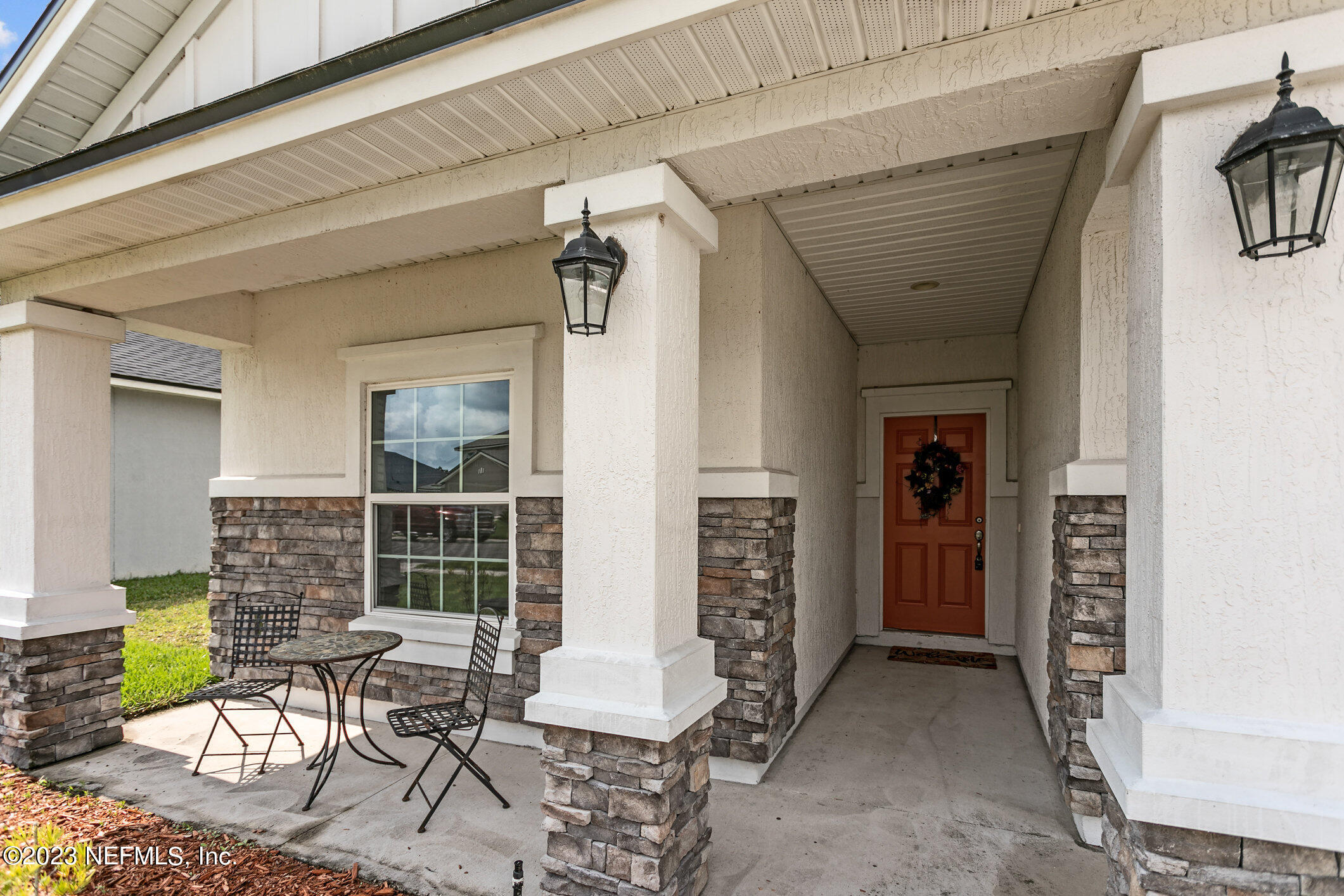 9864 Sailor Drive Jacksonville, FL 32221 - Photo 6 of 44 a view of a patio with table and chairs and potted plants