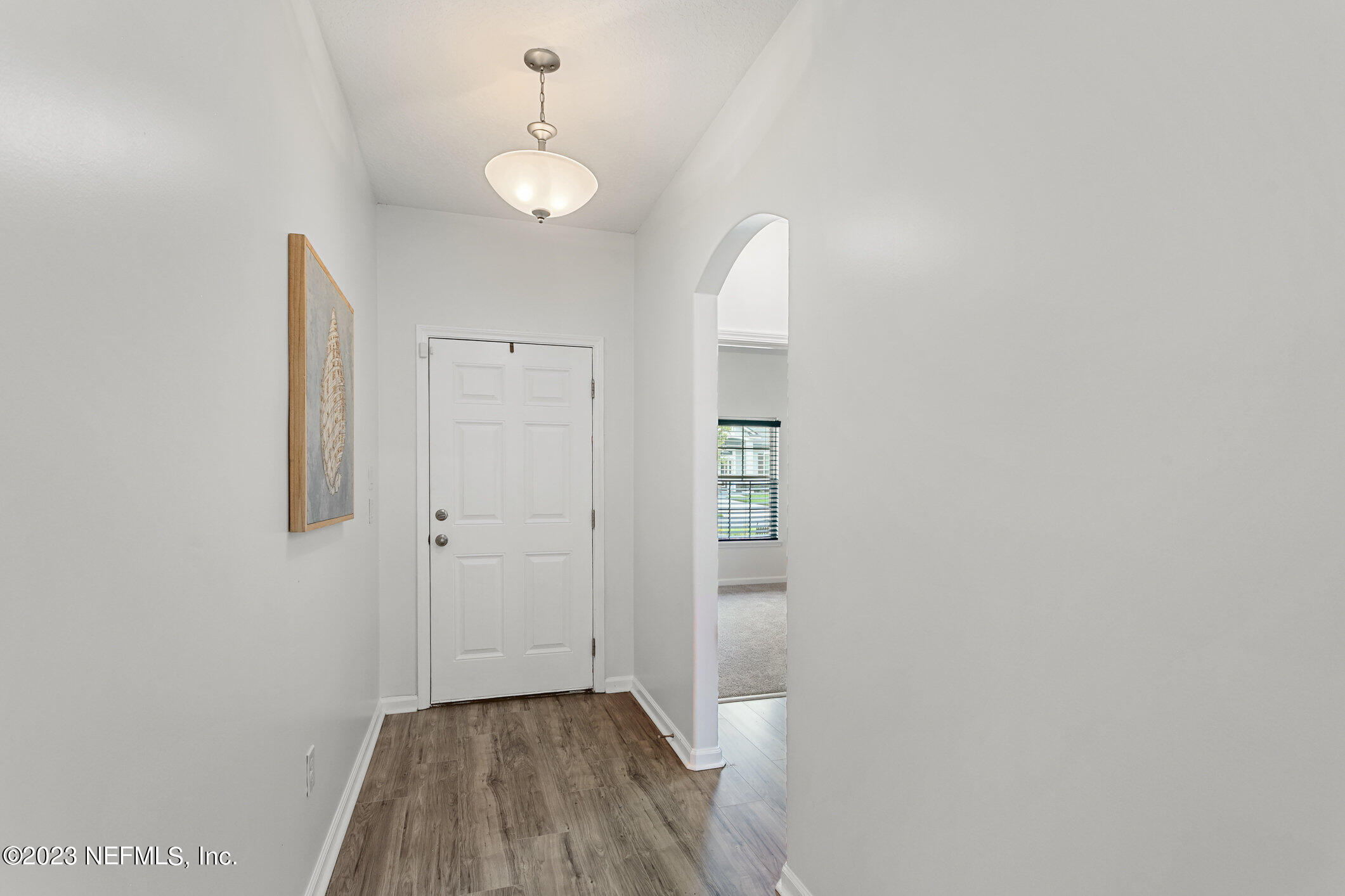 9864 Sailor Drive Jacksonville, FL 32221 - Photo 8 of 44 a view of a hallway with wooden floor
