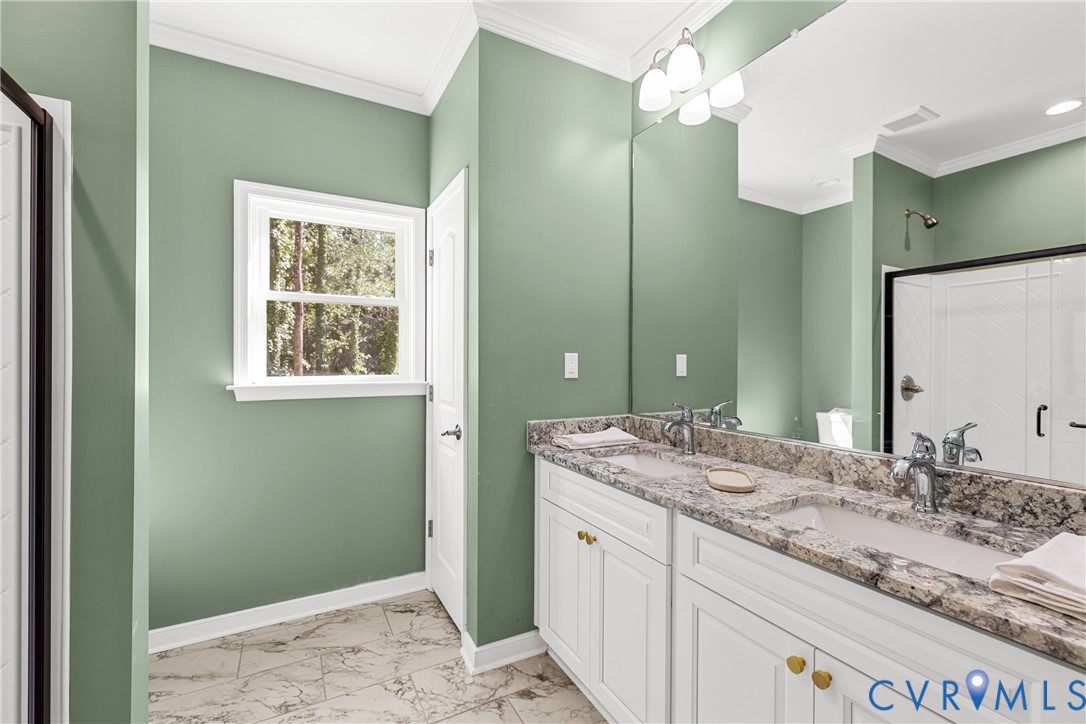 2211 Osborne Road Chester, VA 23831 - Photo 24 of 42 Dual vanity with granite countertop, white cabinet