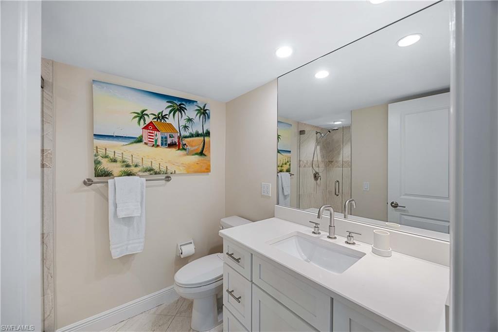 610 Broad Avenue South, Unit J610 Naples, FL 34102 - Photo 11 of 20 Full bath with recessed lighting, vanity, and a shower stall